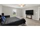 Bedroom boasts neutral walls, a ceiling fan, carpet, and a window showcasing the outdoors at 6645 Honeysuckle Way, Pendleton, IN 46064
