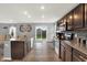 Bright, open kitchen with island, stainless appliances, and easy access to the backyard at 6645 Honeysuckle Way, Pendleton, IN 46064