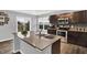 Spacious kitchen with granite island, double sink, stainless appliances and view to backyard at 6645 Honeysuckle Way, Pendleton, IN 46064