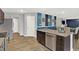 Modern kitchen with a breakfast bar island, stainless steel appliances and accent wall at 6645 Honeysuckle Way, Pendleton, IN 46064