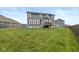 Spacious backyard with lush green grass and the home's exterior at 6923 Bryant Pl, Plainfield, IN 46168