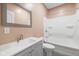 Modern bathroom with a sleek vanity, framed mirror, and a shower over tub at 6923 Bryant Pl, Plainfield, IN 46168