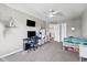Bright bedroom with ceiling fan, neutral carpet, and workspace with desk at 6923 Bryant Pl, Plainfield, IN 46168