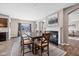 Elegant dining area with a large table, fireplace, and cozy decor at 6923 Bryant Pl, Plainfield, IN 46168