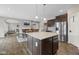 Open kitchen with island, stainless steel appliances, and seamless flow to dining area at 6923 Bryant Pl, Plainfield, IN 46168