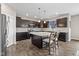 Modern kitchen with dark cabinets, a center island, and stainless steel appliances at 6923 Bryant Pl, Plainfield, IN 46168