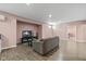 Cozy living room featuring a comfy couch, a TV, and durable wood-look flooring at 6923 Bryant Pl, Plainfield, IN 46168