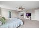 Bright primary bedroom with ceiling fan and ensuite bathroom at 6923 Bryant Pl, Plainfield, IN 46168