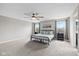 Spacious primary bedroom with large windows, neutral walls, and ceiling fan at 6923 Bryant Pl, Plainfield, IN 46168