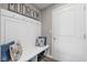 Cozy mudroom featuring bench with storage and decorative pillows at 6923 Bryant Pl, Plainfield, IN 46168