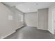 Versatile room with a window, neutral walls and concrete floors at 6923 Bryant Pl, Plainfield, IN 46168