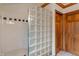 Bathroom featuring tiled shower with glass block divider at 7141 Ember Ct, Indianapolis, IN 46236