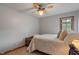 Bedroom featuring a ceiling fan and a well-made bed at 7141 Ember Ct, Indianapolis, IN 46236