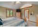 Comfortable bedroom with wood accents, carpet, and a television at 7141 Ember Ct, Indianapolis, IN 46236