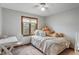 Bedroom featuring a ceiling fan and a cozy bed at 7141 Ember Ct, Indianapolis, IN 46236