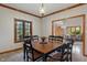 Charming dining room with wood trim, a classic light fixture, and an open view at 7141 Ember Ct, Indianapolis, IN 46236