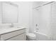 Clean bathroom featuring a white vanity, toilet, and shower-tub combination with modern fixtures at 7431 Stillness Dr, Indianapolis, IN 46268