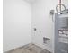 Utility room features tile floor and newer water heater at 7431 Stillness Dr, Indianapolis, IN 46268