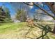 Spacious backyard with swing, trees, and storage shed at 8120 Trevellian Way, Indianapolis, IN 46217
