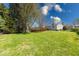 Lush backyard featuring a fenced pool with a wooden deck at 8120 Trevellian Way, Indianapolis, IN 46217