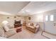 Finished basement with cozy seating area, built-in shelving, and entertainment space for a relaxed atmosphere at 8120 Trevellian Way, Indianapolis, IN 46217