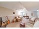 Well-lit basement with two sofas, guitars, built-in shelves and entertainment area for versatile living space at 8120 Trevellian Way, Indianapolis, IN 46217