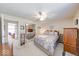 Bright bedroom with a queen-sized bed and a view of an adjacent room at 8120 Trevellian Way, Indianapolis, IN 46217