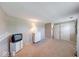 Large bedroom featuring neutral colors, dresser, and ample closet space, providing a serene atmosphere at 8120 Trevellian Way, Indianapolis, IN 46217