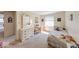 Sunlit bedroom featuring a cozy single bed, dresser, and mirror complemented by whimsical wall art at 8120 Trevellian Way, Indianapolis, IN 46217
