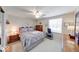 Comfortable bedroom with queen-size bed, dresser, and ample natural light at 8120 Trevellian Way, Indianapolis, IN 46217