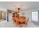 Cozy dining room features a wood table with seating for six and an overhead fan at 8120 Trevellian Way, Indianapolis, IN 46217