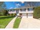 Charming two-story home with a well-maintained lawn and attached two-car garage at 8120 Trevellian Way, Indianapolis, IN 46217