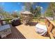 Outdoor patio features wood deck with dining set and grill; ideal for outdoor entertaining at 8120 Trevellian Way, Indianapolis, IN 46217
