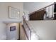 Inviting staircase with plush carpeting and wood railing leads to the upper level at 8120 Trevellian Way, Indianapolis, IN 46217