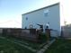 A spacious wooden deck is attached to the home and leads out into the lawn, perfect for outdoor entertainment at 8609 Wheatfield Dr, Camby, IN 46113
