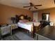 Warm bedroom with a wooden bed, coordinating furniture, and carpet underneath at 8609 Wheatfield Dr, Camby, IN 46113