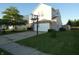 View of the front of the home with a driveway, lawn, mature tree, vinyl siding, and a basketball hoop at 8609 Wheatfield Dr, Camby, IN 46113