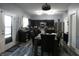 Well-lit kitchen featuring stainless steel appliances, dark wood cabinets, and a dining area perfect for Gathering meals at 8609 Wheatfield Dr, Camby, IN 46113