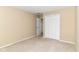 A bright bedroom with closet and neutral carpet at 8713 Champions Dr, Indianapolis, IN 46256