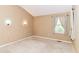 Neutral bedroom with carpet flooring and a window, creating a calm and inviting space at 8713 Champions Dr, Indianapolis, IN 46256
