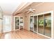 The enclosed patio has access doors to the kitchen, breakfast nook, and exterior at 8713 Champions Dr, Indianapolis, IN 46256