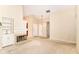 Open living room with fireplace, neutral walls, and carpet flooring at 8713 Champions Dr, Indianapolis, IN 46256