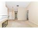 View of an open living room with a fireplace, access to other rooms and neutral decor at 8713 Champions Dr, Indianapolis, IN 46256