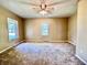 Comfortable bedroom with carpet, neutral walls, and plenty of natural light from the windows at 901 Columbia Ave, Alexandria, IN 46001