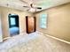 This bedroom features neutral paint, carpeted floor, and an included wood cabinet at 901 Columbia Ave, Alexandria, IN 46001