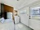 Laundry room with washer and dryer, hot water tank, and door to exterior at 901 Columbia Ave, Alexandria, IN 46001