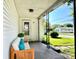 Inviting front porch with seating, decorative pillars, and a view of the neighborhood at 901 Columbia Ave, Alexandria, IN 46001