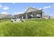 Expansive backyard view showcasing patio, grilling area, fire pit, and lush lawn, creating an ideal outdoor space at 998 Cherry Tree Ln, Greenwood, IN 46143