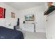 The bedroom has neutral walls and carpeting, furnished with a large dresser and flat screen television at 998 Cherry Tree Ln, Greenwood, IN 46143