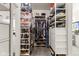 Organized walk-in closet with custom shelving, hanging rods, and ample storage space for clothing and accessories at 998 Cherry Tree Ln, Greenwood, IN 46143